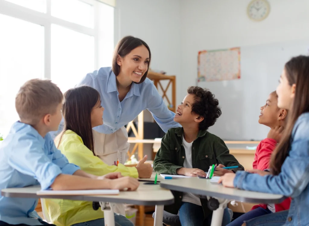 Teacher engaging with students in classroom discussion.