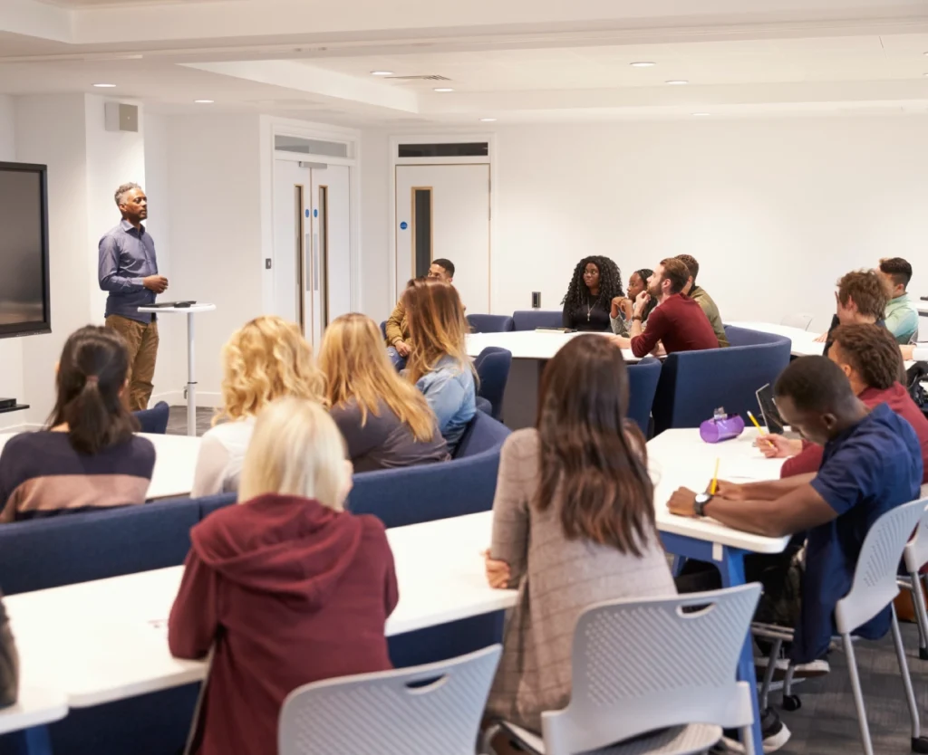 Classroom lecture with students attentively listening.