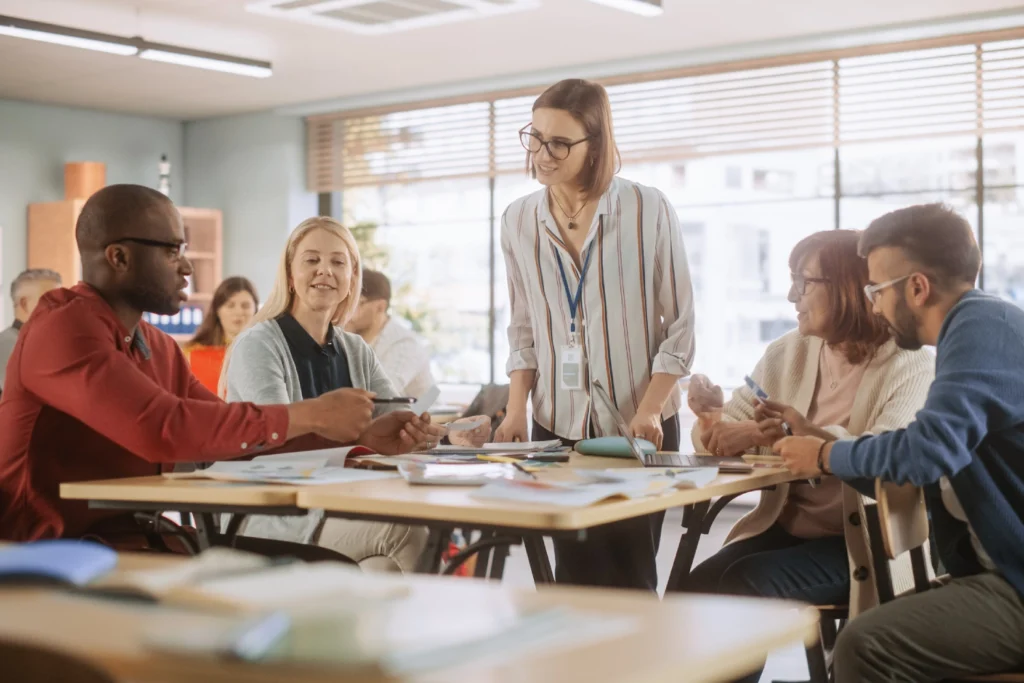 People collaborating in a classroom setting.