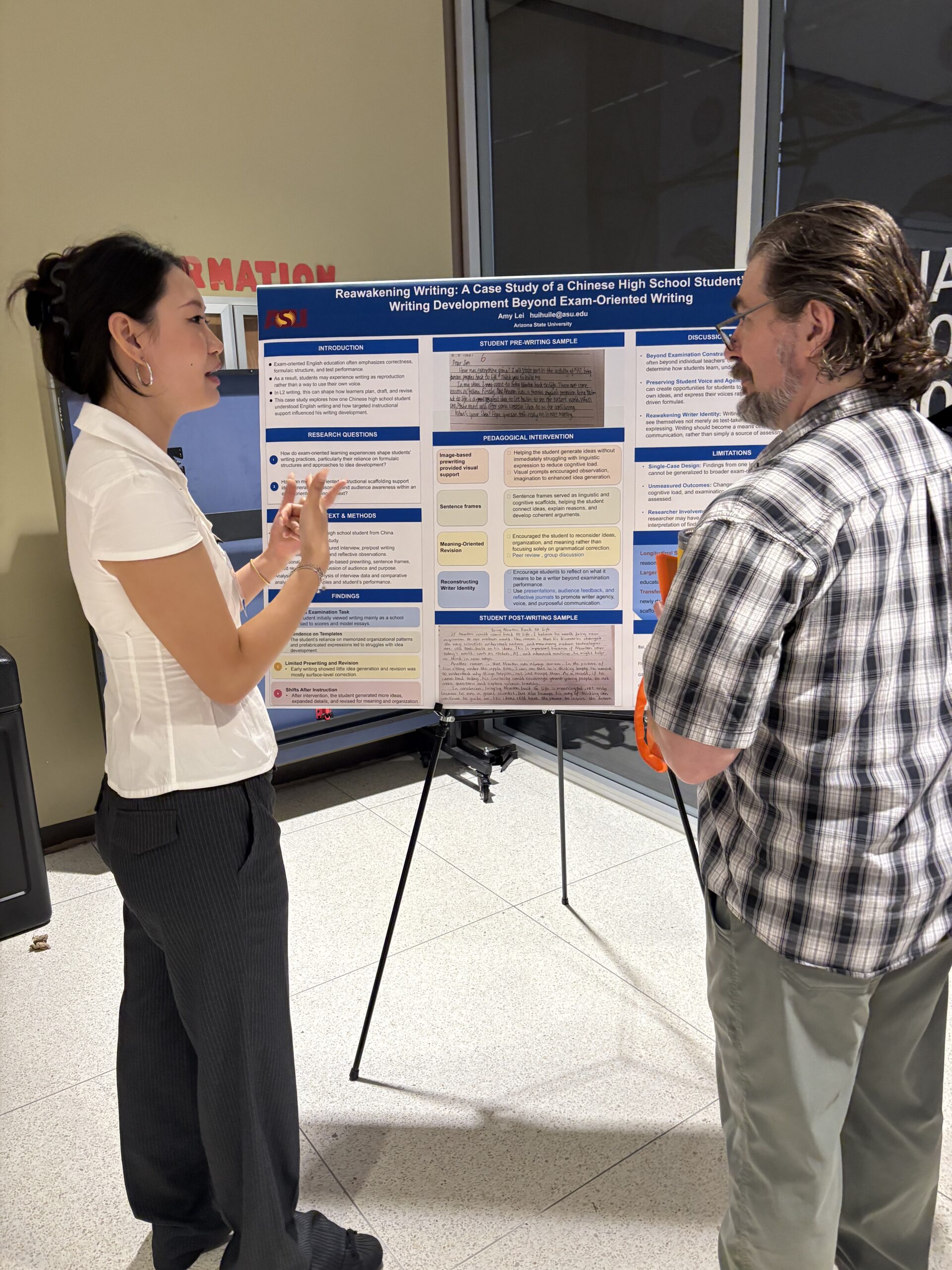 Man and woman standing in front of a research poster discussing content