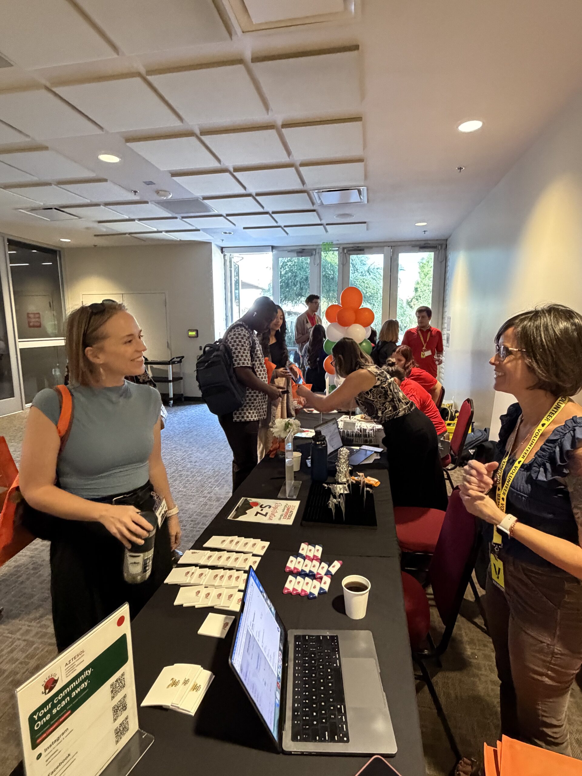 Person checking in for conference at registration table