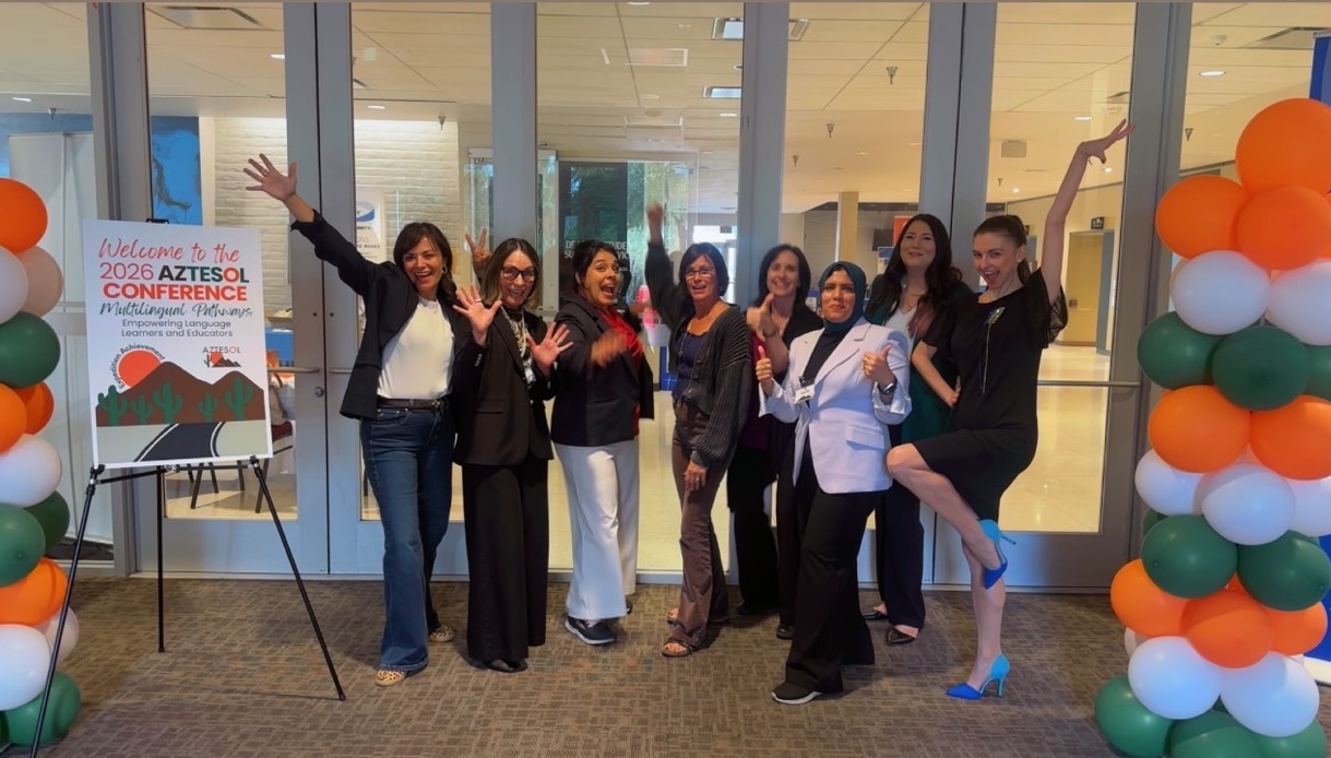 Eight women Board members posing in celebration